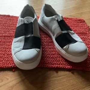 Armani Exchange Shoes. Size 9. Slip on sneakers.  Excellent preowned condition.